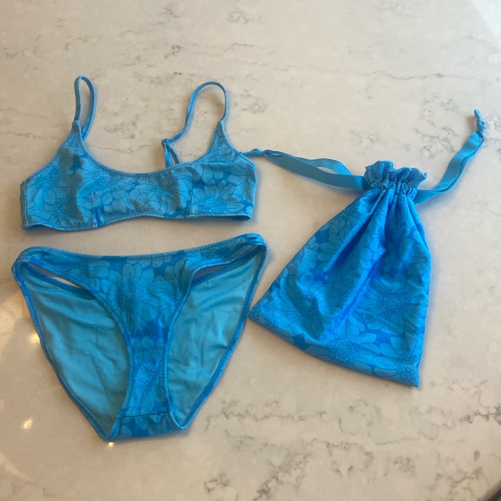 Triangl two piece swimsuit with matching swim bag.